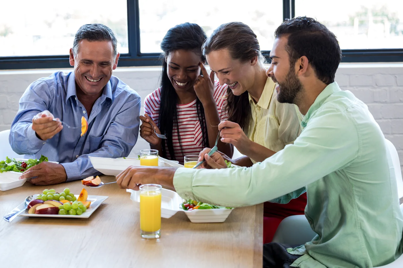 A patient enjoying a meal without fear of an attack after private gallbladder removal surgery